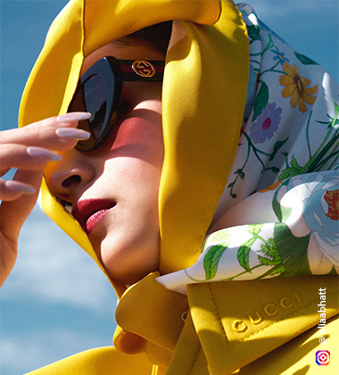 alia bhatt in a yellow suit against a beach background